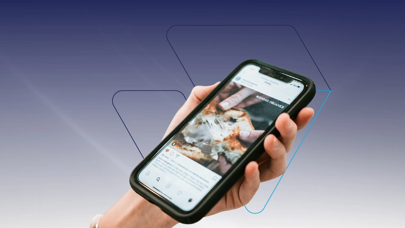 Person viewing a restaurant's website with pizza image on a smartphone â€” web design for restaurant showcased on mobile.